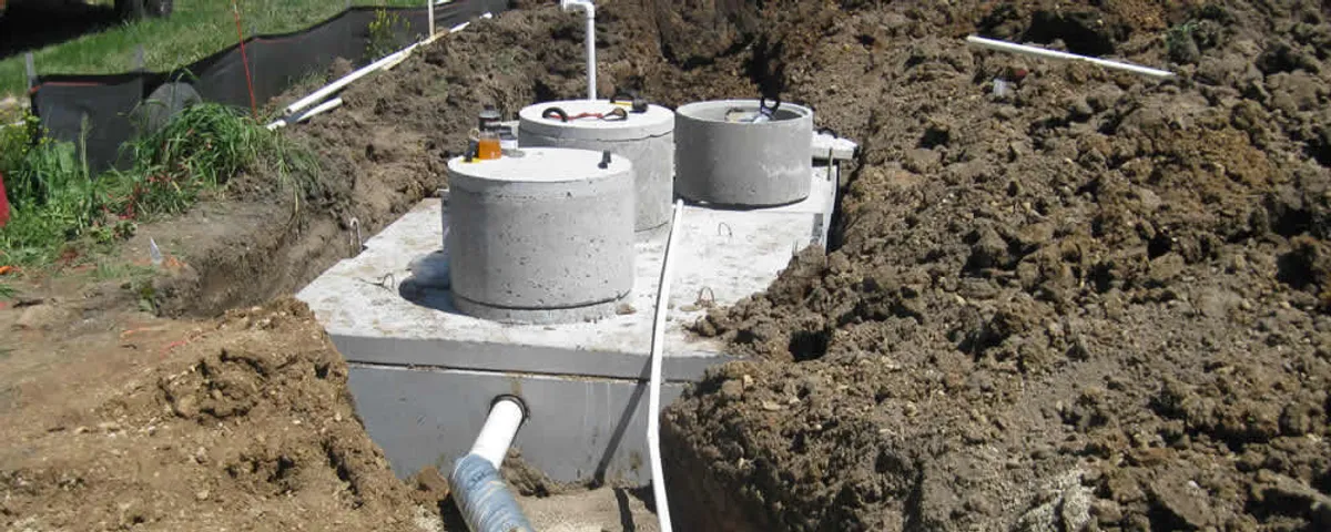 Septic system repair and installation site with tank access ports in Cleveland, OH