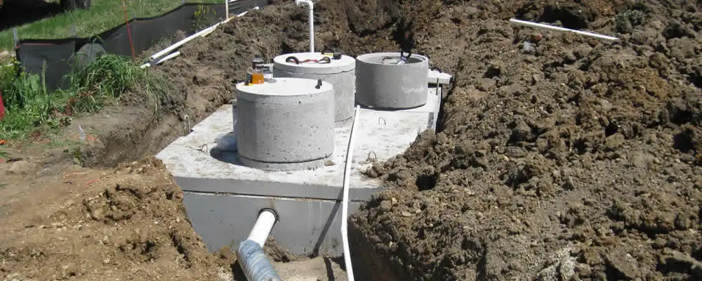 Septic system repair and installation site with tank access ports in Cleveland, OH