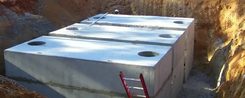 Septic tank installation site with a newly placed concrete tank in Cleveland, OH
